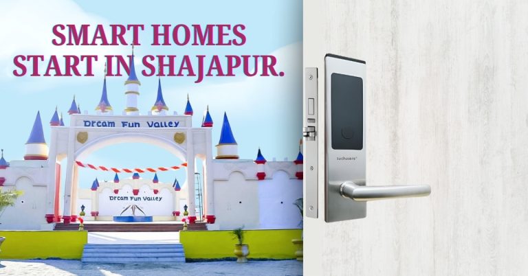 Modern smart lock installed on a white door, promoting smart home security in Shajapur with Dream Fun Valley in the background.